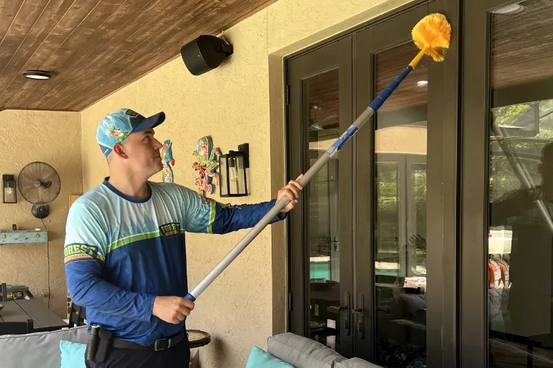Forest Pest Control technician performing a pest control inspection in Central Florida